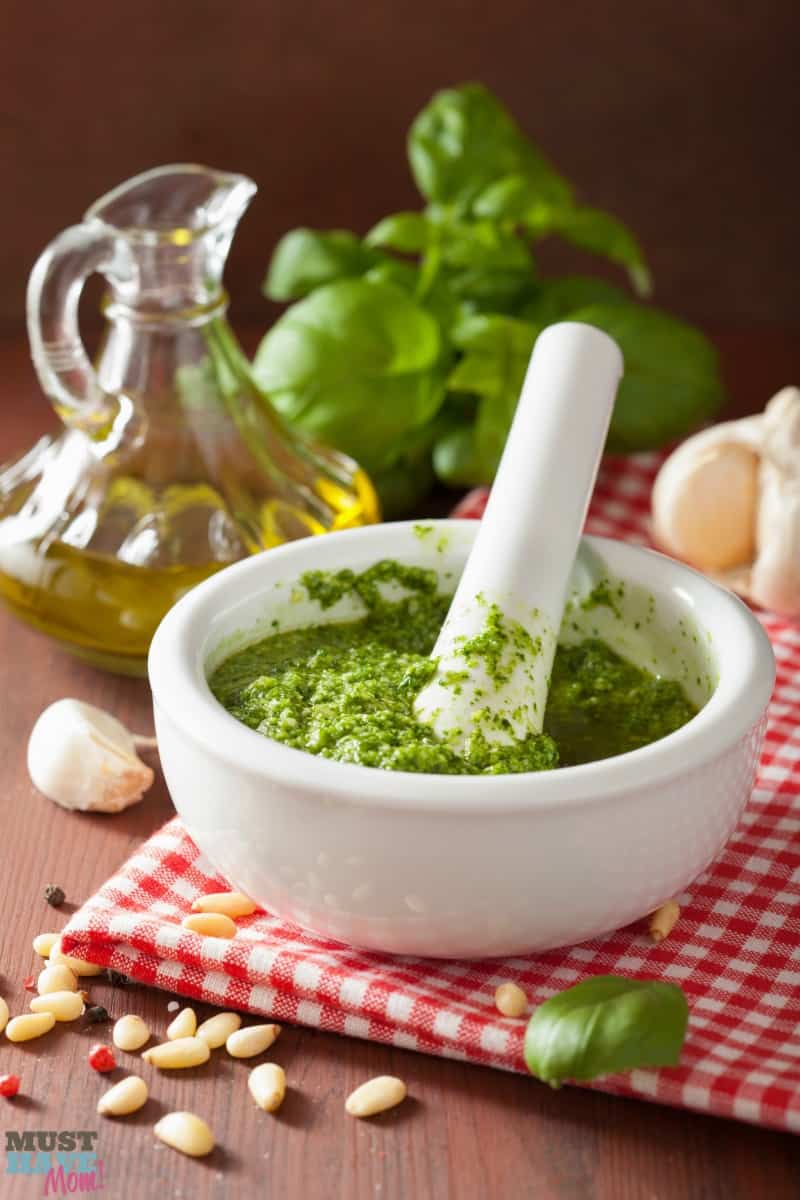 pesto sauce and ingredients over wooden rustic background