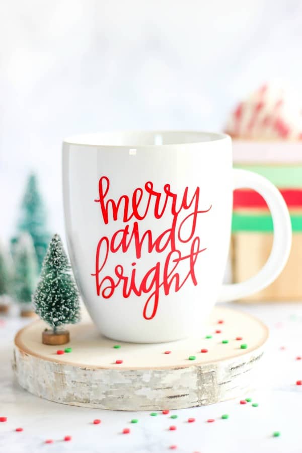 Enjoy the holiday season with a DIY Merry and Bright Vinyl Mug. It's perfect for sipping a cup of coffee or hot chocolate on a cold winter day. It makes a great gift idea too!