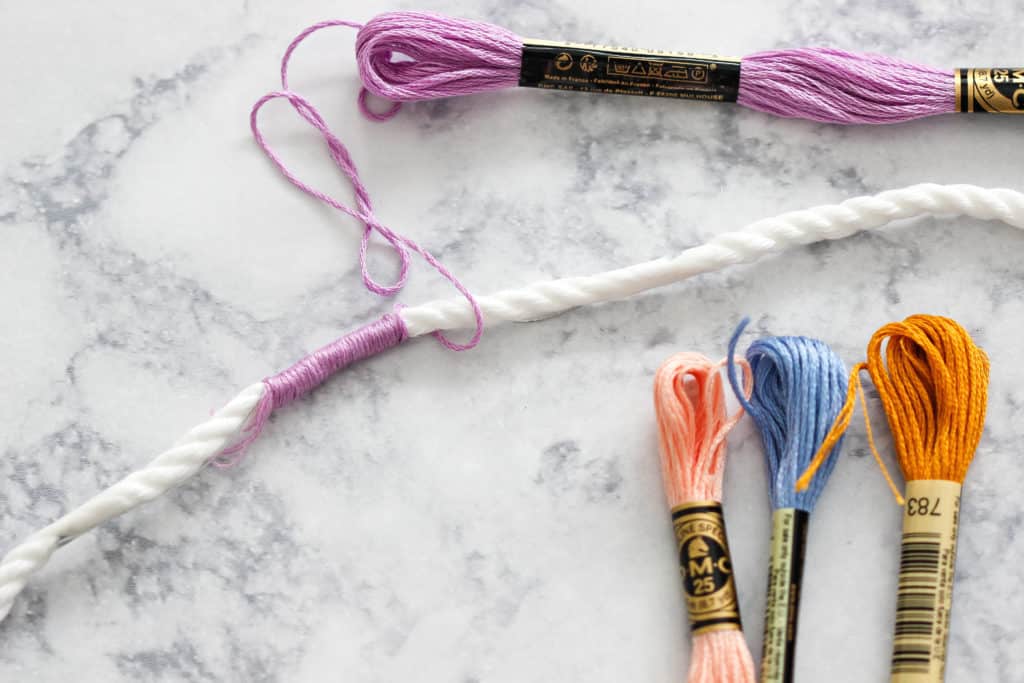 Learn How To Make A Colorful, Fun Rope And Yarn Keychain using regular household items like cotton and embroidery thread. #diy #keychain #howtomake #yarn #kidscrafts