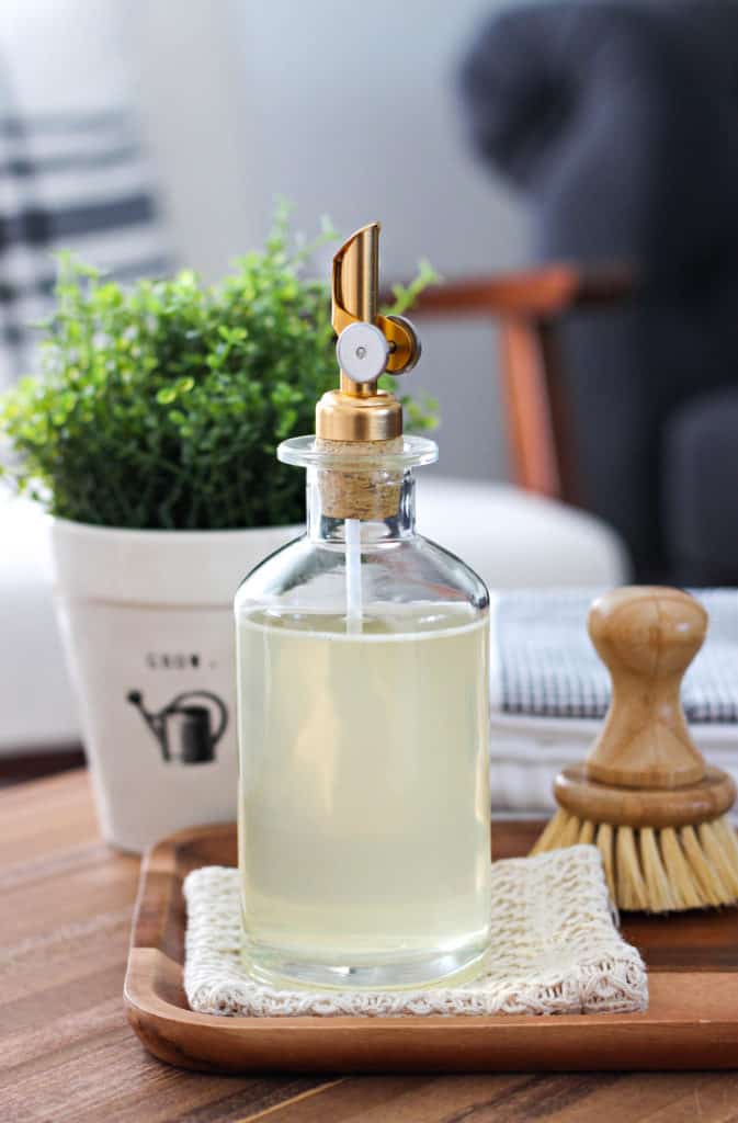Looking for a soap that is chemical-free and actually cleans well? Learn how to make all natural dish and hand soap with just 3 ingredients. #diy #dishsoapdiy #dishsoaphomemade #dishdispenser #handsoapdiy #handsoapessentialoil #handsoapdiycastille