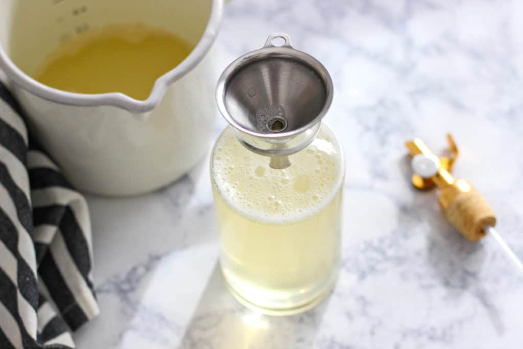 Looking for a soap that is chemical-free and actually cleans well? Learn how to make all natural dish and hand soap with just 3 ingredients. #diy #dishsoapdiy #dishsoaphomemade #dishdispenser #handsoapdiy #handsoapessentialoil #handsoapdiycastille